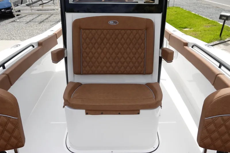 Slide: The Image of Control panel of 2026 Sea Hunt Gamefish 28 FS boat with steering and throttle controls. - 30