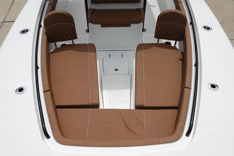 Slide: The Image of 2026 Sea Hunt Gamefish 28 FS boat with brown cushioned seating. - 32