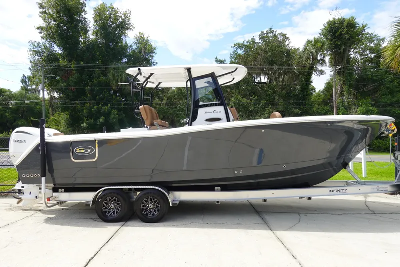 Slide: The Image of 2026 Sea Hunt Gamefish 28 FS boat on trailer, front view, outdoors. - 4