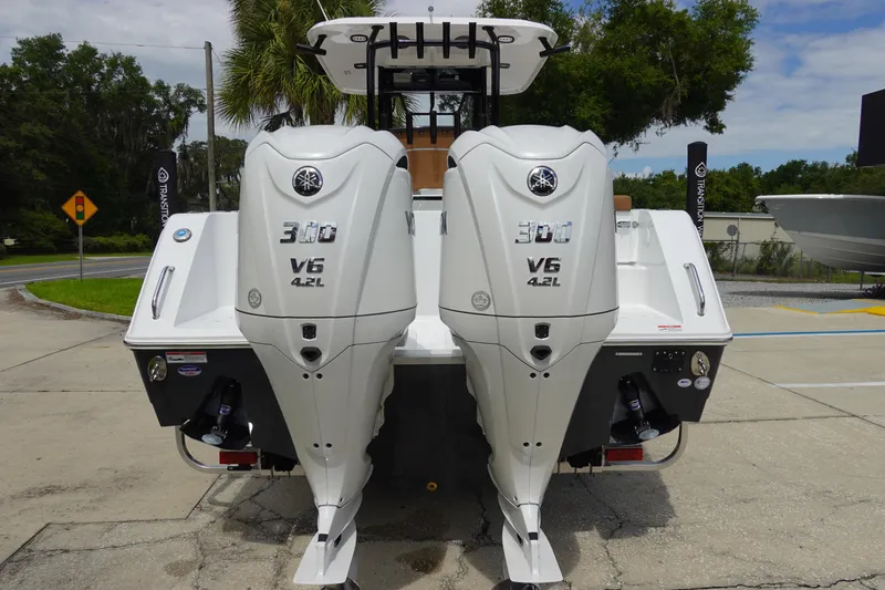 Slide: The Image of 2026 Sea Hunt Gamefish 28 FS boat on trailer, parked outdoors. - 5