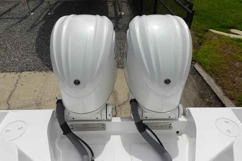 Slide: The Image of 2026 Sea Hunt Gamefish 28 FS boat with a mounted ladder on the stern. - 7