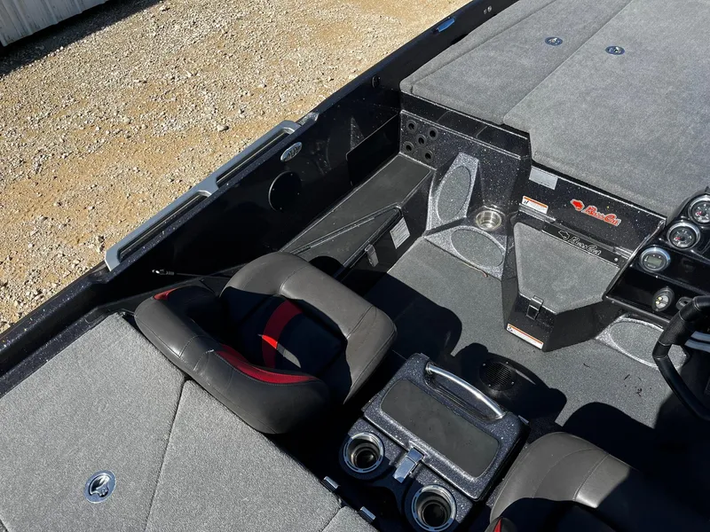 Slide: The Image of 2020 Bass Cat Lynx boat interior with seating and control panel. - 10