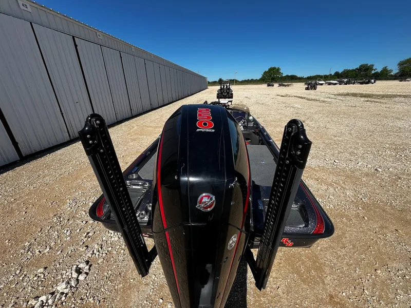 Slide: The Image of 2020 Bass Cat Lynx boat with dual power poles on gravel lot. - 8