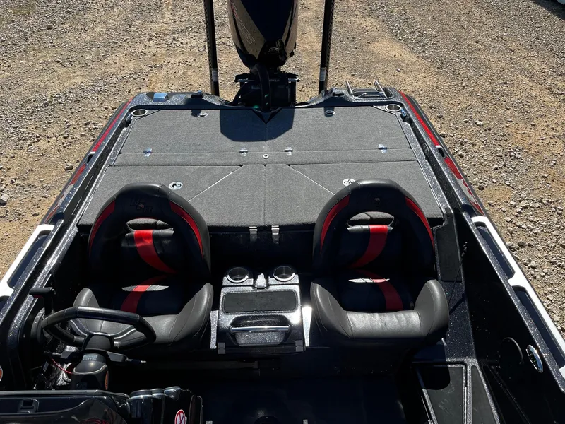 Slide: The Image of 2020 Bass Cat Lynx boat interior with dual seats and steering wheel. - 9