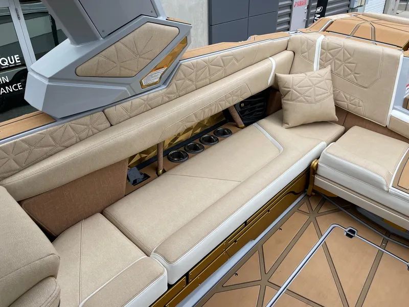 Slide: The Image of Luxurious seating in the 2024 Nautique Super Air Nautique G25 Paragon boat. - 7