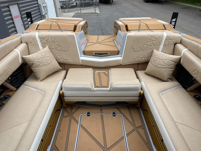 Slide: The Image of 2024 Nautique Super Air Nautique G25 Paragon interior with luxurious beige seating. - 8