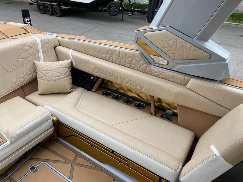 Slide: The Image of 2024 Nautique Super Air Nautique G25 Paragon interior with luxurious beige seating and stylish design. - 9