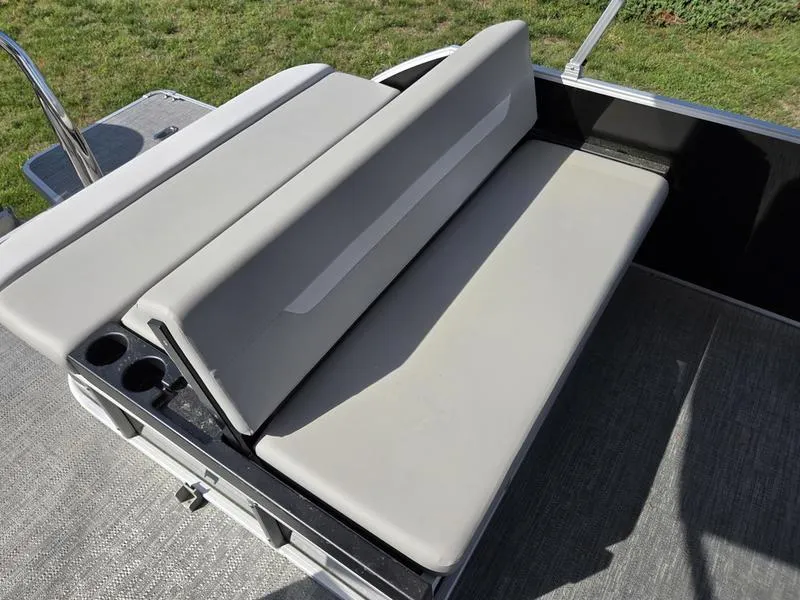 Slide: The Image of 2025 Godfrey Xperience 2286 SFLX Sport Tube boat seating area with cup holders. - 13