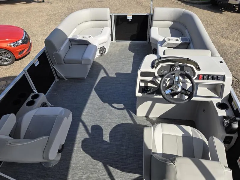 Slide: The Image of 2025 Godfrey Xperience 2286 SFLX Sport Tube pontoon boat interior with modern seating and steering console. - 15