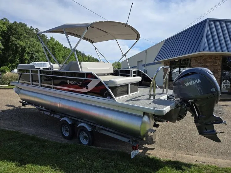 Slide: The Image of 2025 Godfrey Xperience 2286 SFLX pontoon boat with Yamaha engine on trailer. - 4