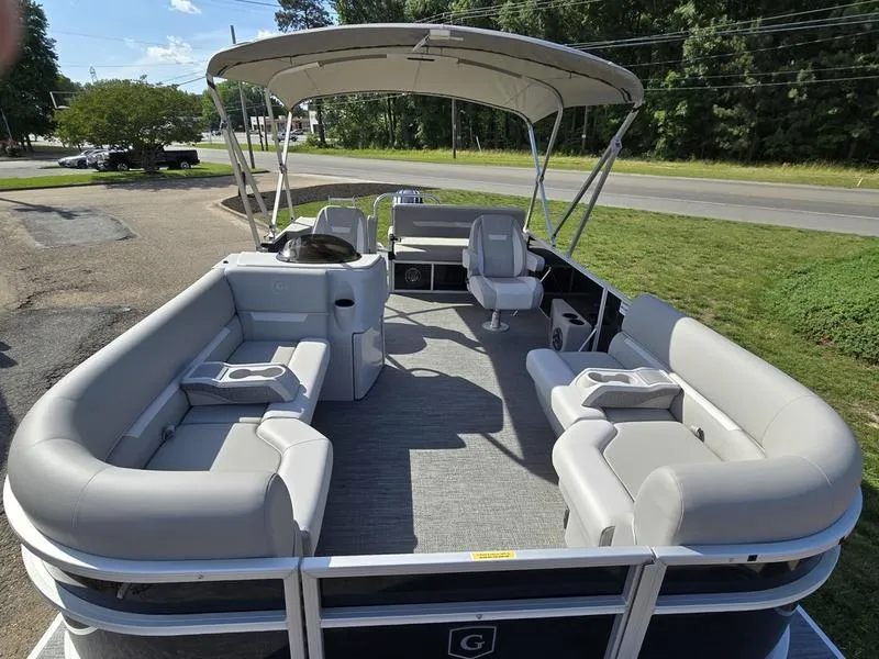 Slide: The Image of 2025 Godfrey Xperience 2286 SFLX pontoon boat with spacious seating and canopy. - 7