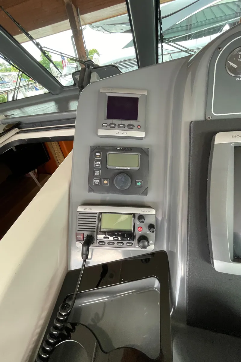 Slide: The Image of Control panel of a 2002 Pursuit 3800 Express boat with navigation equipment. - 30