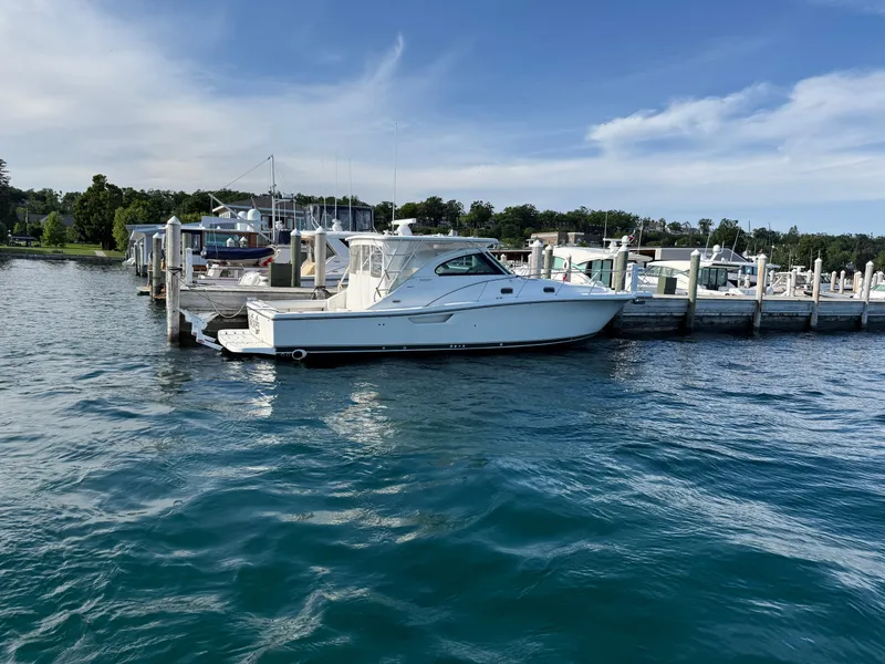 Slide: The Image of 2002 Pursuit 3800 Express yacht docked at marina on a sunny day. - 9