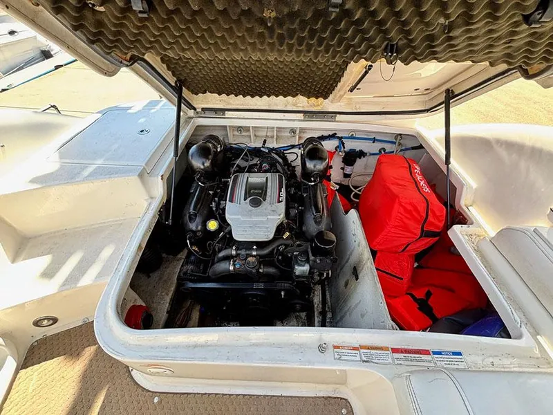 Slide: The Image of Engine compartment of a 2013 Sea Ray 240 Sundeck boat, featuring a well-maintained motor. - 16