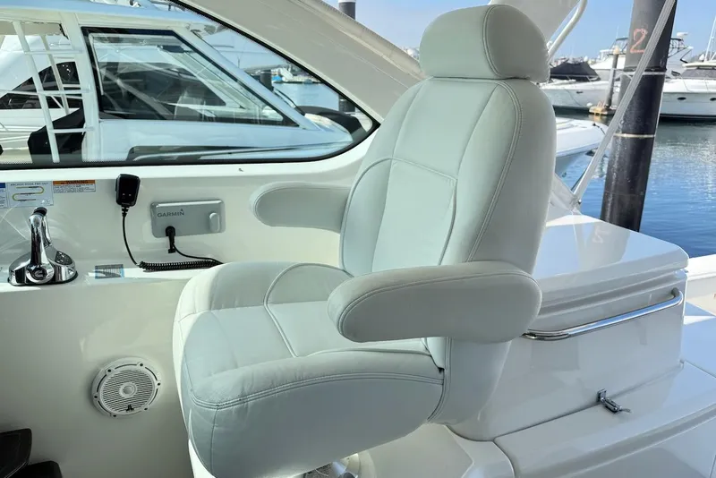 Slide: The Image of Captain's chair on 2020 Tiara Yachts 3900 Open "Coronet" with marina view. - 15