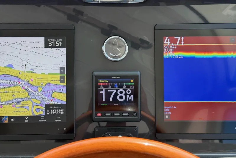 Slide: The Image of Dashboard of 2020 Tiara Yachts 3900 Open "Coronet" with navigation and sonar displays. - 17