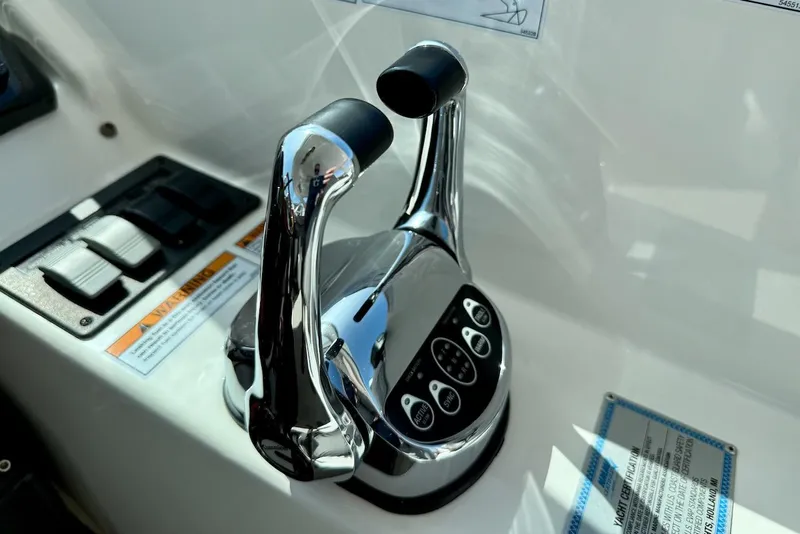 Slide: The Image of Control panel of 2020 Tiara Yachts 3900 Open "Coronet" with chrome throttle levers. - 20
