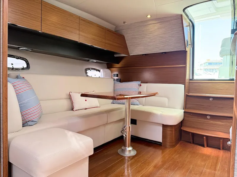 Slide: The Image of Luxurious interior of 2020 Tiara Yachts 3900 Open "Coronet" with elegant seating and wooden finishes. - 28