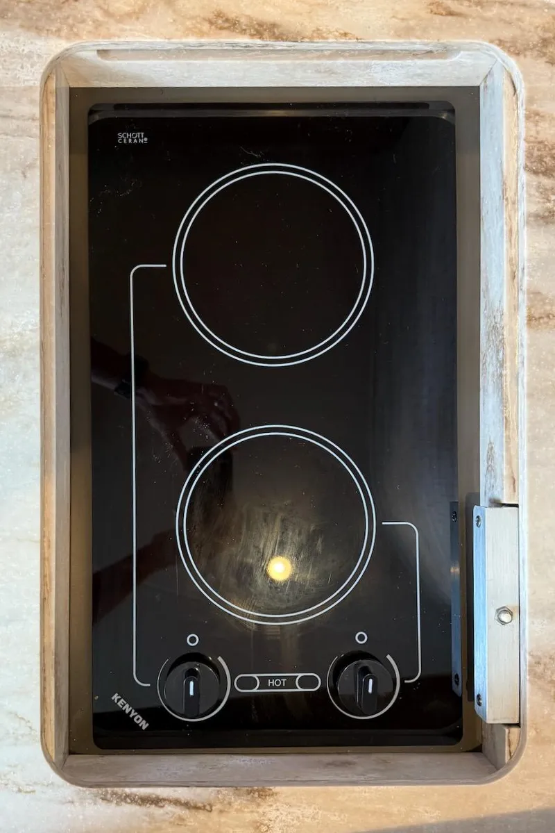 Slide: The Image of Ceramic cooktop on 2020 Tiara Yachts 3900 Open "Coronet" model, featuring dual burners. - 35