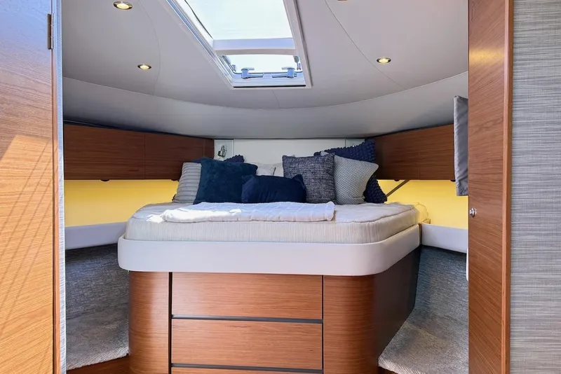Slide: The Image of Luxurious cabin interior of 2020 Tiara Yachts 3900 Open "Coronet" with skylight and cozy bedding. - 37