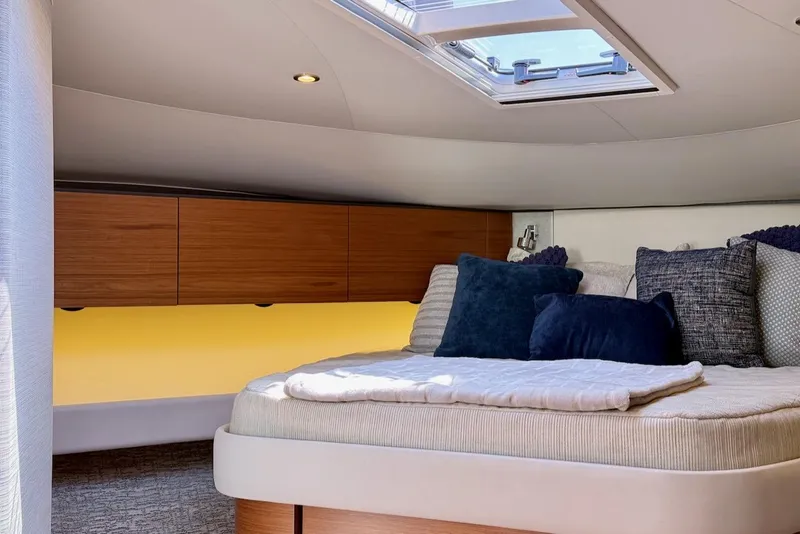 Slide: The Image of Luxurious cabin interior of 2020 Tiara Yachts 3900 Open "Coronet" with skylight and cushions. - 40