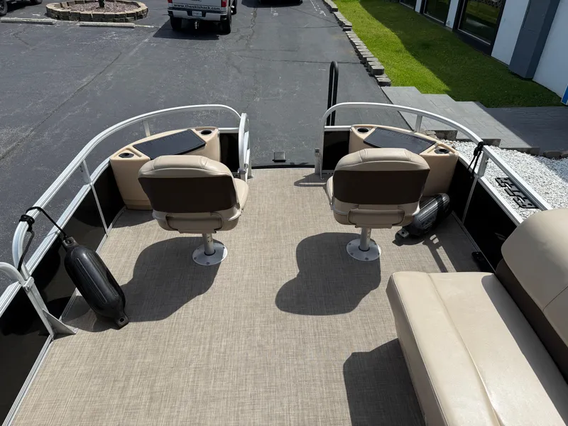 Slide: The Image of 2019 Sun Tracker Fishin' Barge 24 DLX interior with seating and fishing setup. - 15