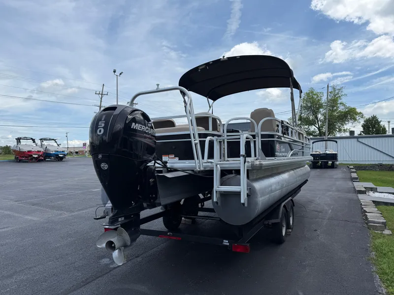 Slide: The Image of 2019 Sun Tracker Fishin' Barge 24 DLX pontoon boat with Mercury outboard motor. - 5