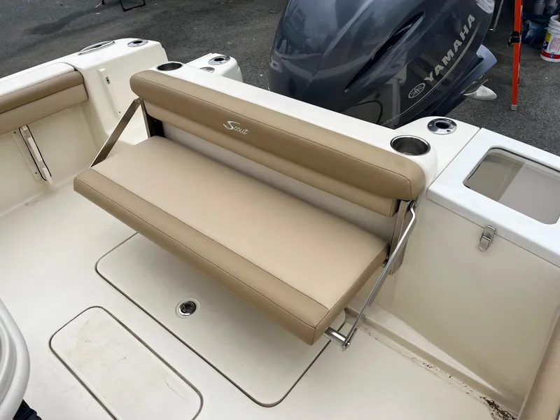 Slide: The Image of 2020 Scout 215 XSF boat with beige foldable bench seat and Yamaha engine. - 12