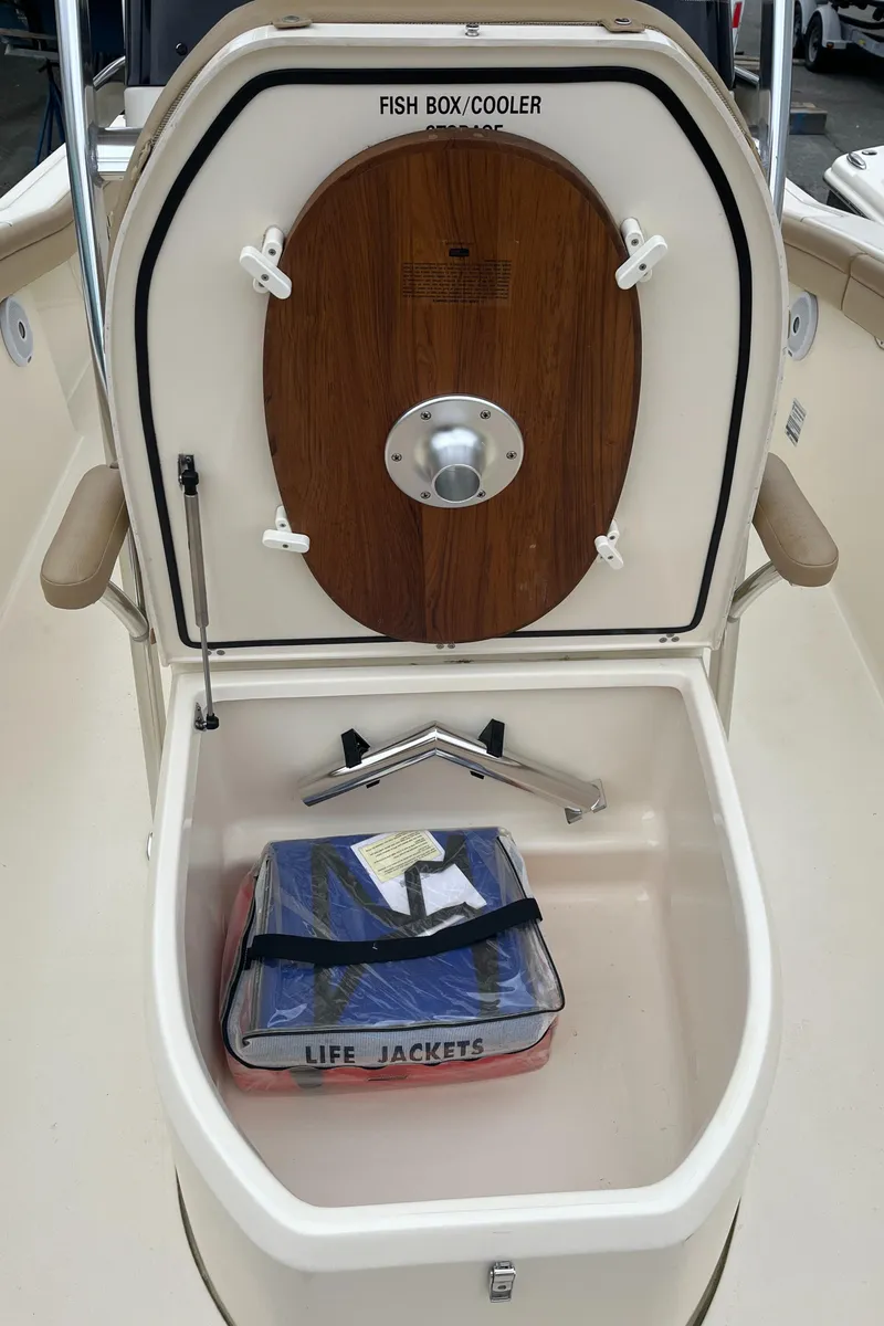 Slide: The Image of 2020 Scout 215 XSF fish box cooler with life jackets stored inside. - 17