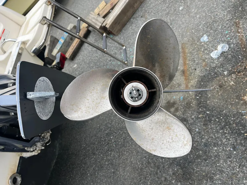 Slide: The Image of Propeller of a 2020 Scout 215 XSF boat on a concrete surface. - 5