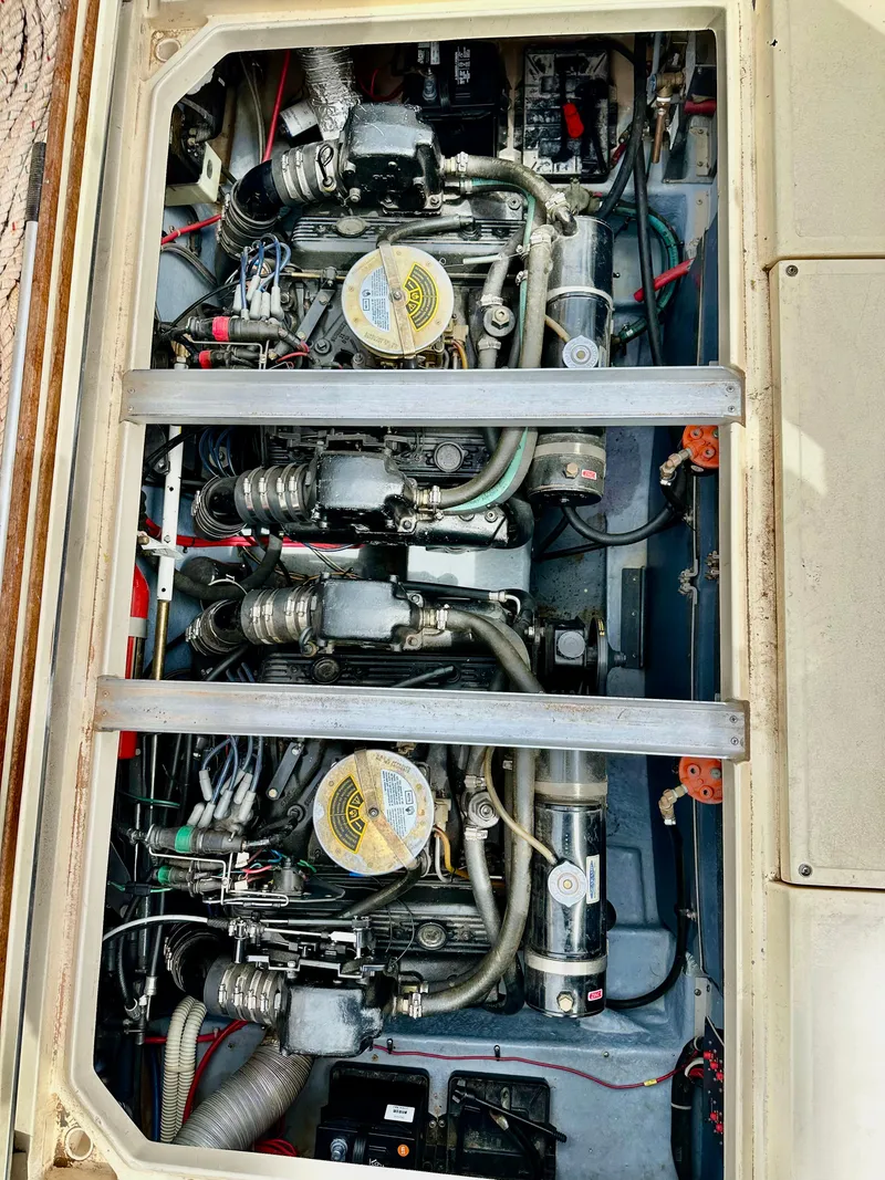Slide: The Image of Engine compartment of a 1987 Sea Ray 270 Sundancer boat, showcasing dual engines. - 10