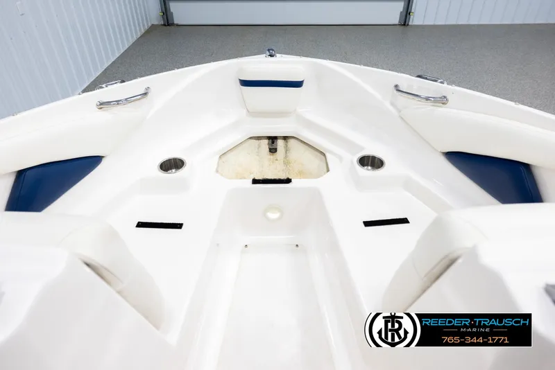 Slide: The Image of Bow area of a 2008 Regal 1900 boat with seating and cup holders. - 16