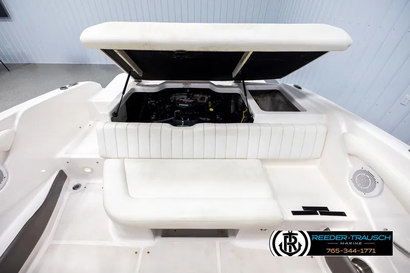 Slide: The Image of 2008 Regal 1900 boat interior with open engine compartment, white seating, and logo. - 20