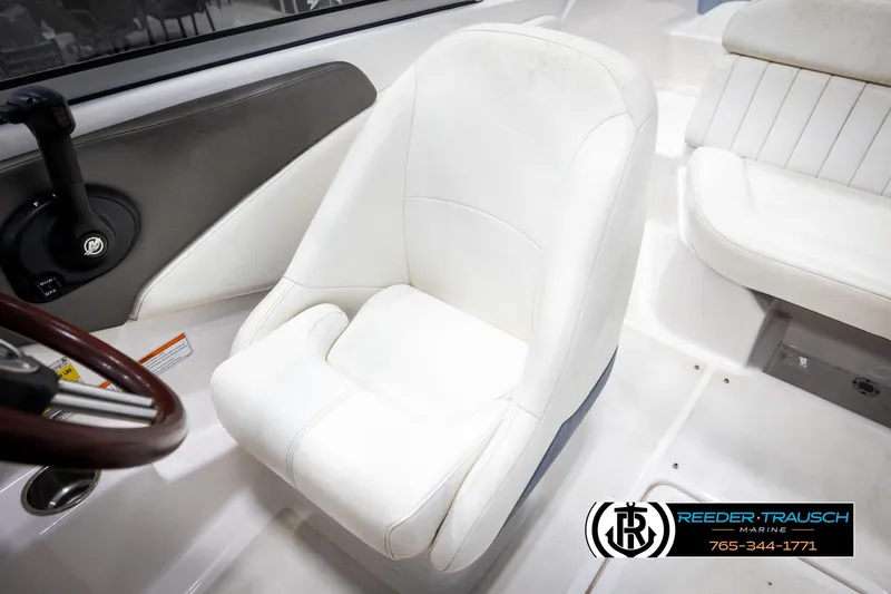 Slide: The Image of White captain's chair in 2008 Regal 1900 boat interior. - 21
