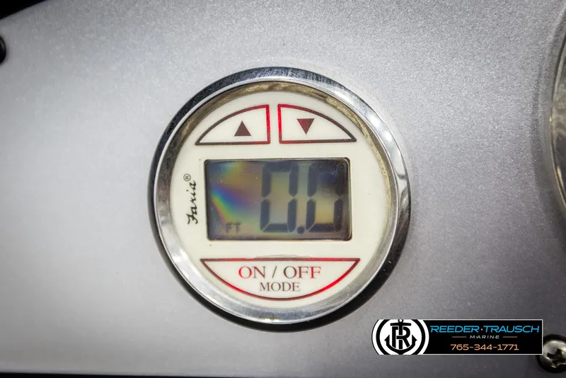 Slide: The Image of Digital display on a 2008 Regal 1900 boat dashboard, showing 0.0 feet. - 26