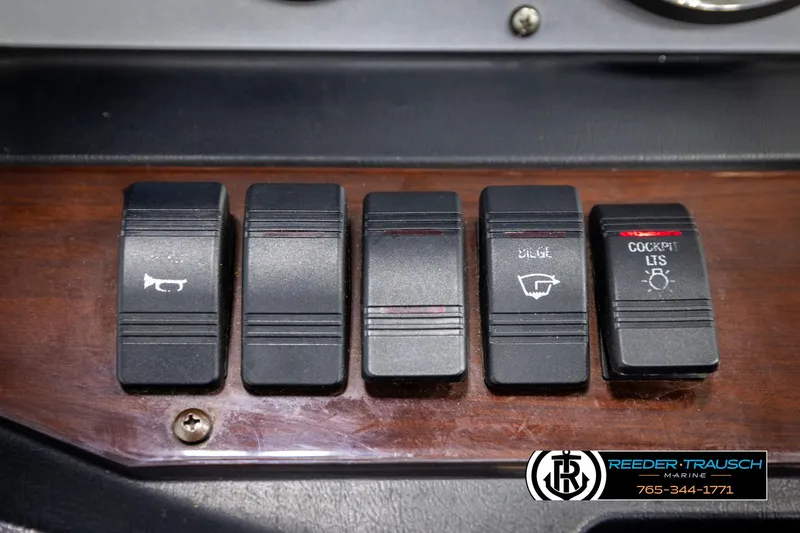Slide: The Image of Dashboard switches of a 2008 Regal 1900 boat, featuring various control buttons. - 27