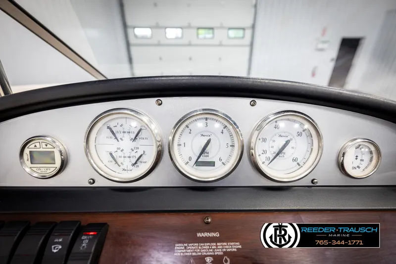 Slide: The Image of Dashboard of a 2008 Regal 1900 boat with gauges and controls. - 28