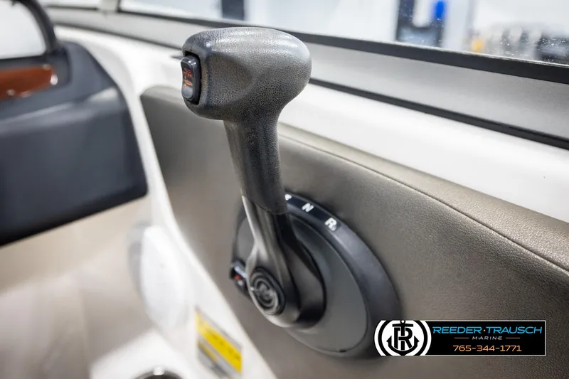 Slide: The Image of Throttle control lever in a 2008 Regal 1900 boat interior. - 30