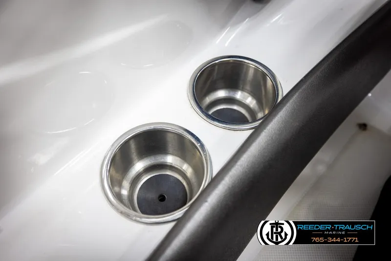 Slide: The Image of Cup holders in a 2008 Regal 1900 boat interior, featuring sleek stainless steel design. - 34