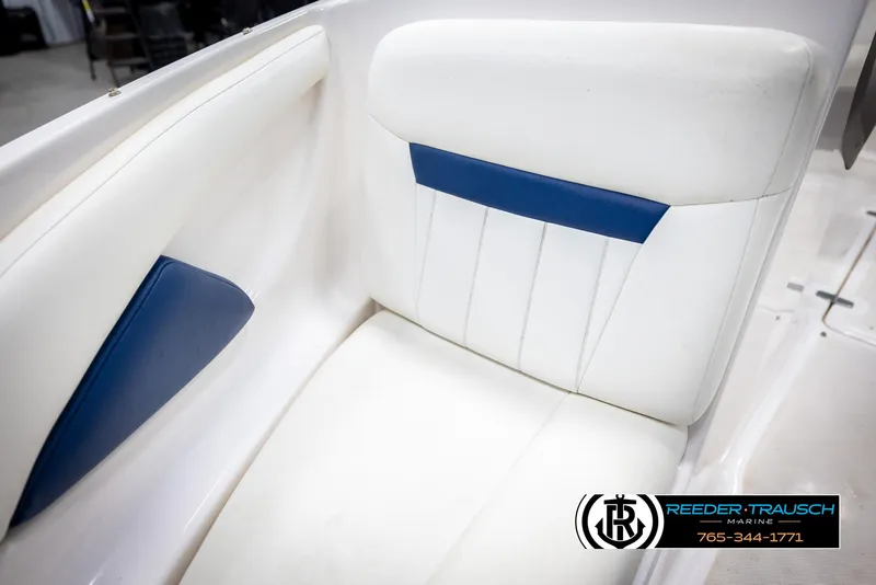 Slide: The Image of White and blue boat seat in a 2008 Regal 1900 model. - 36