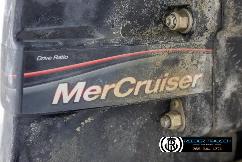 Slide: The Image of Close-up of a 2008 Regal 1900 MerCruiser engine component with visible bolts and branding. - 42