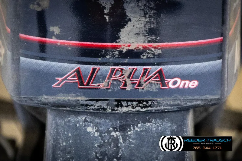 Slide: The Image of Alpha One logo on a weathered surface, featuring Reeder-Trausch Marine branding. - 43