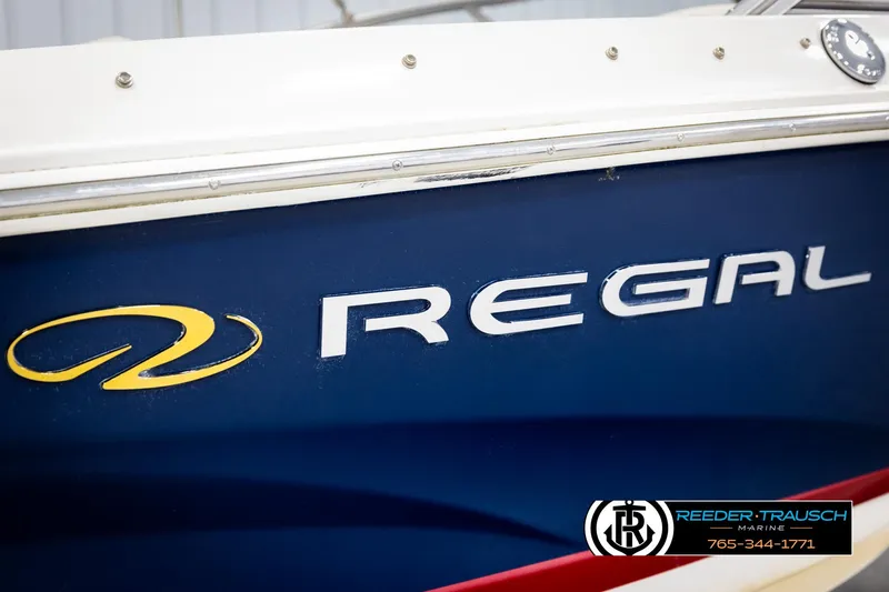 Slide: The Image of Blue 2008 Regal 1900 boat with logo and contact information displayed. - 45