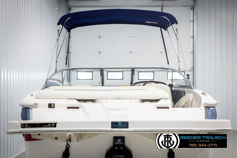 Slide: The Image of 2008 Regal 1900 boat with blue canopy in storage facility. - 7