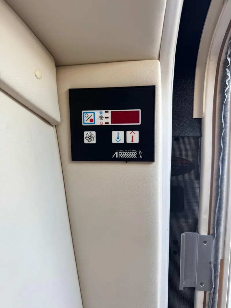 Slide: The Image of Control panel on a 2006 Bayliner 325 boat interior. - 23