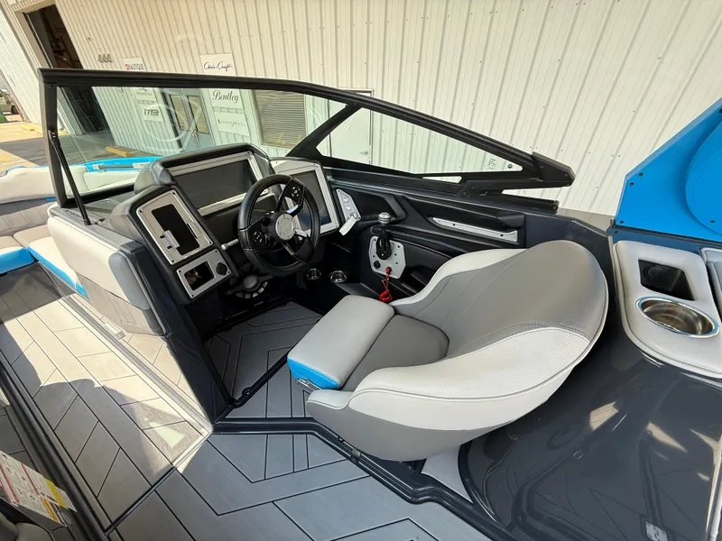 Slide: The Image of 2020 Supra SE550 boat interior with modern dashboard and comfortable seating. - 10
