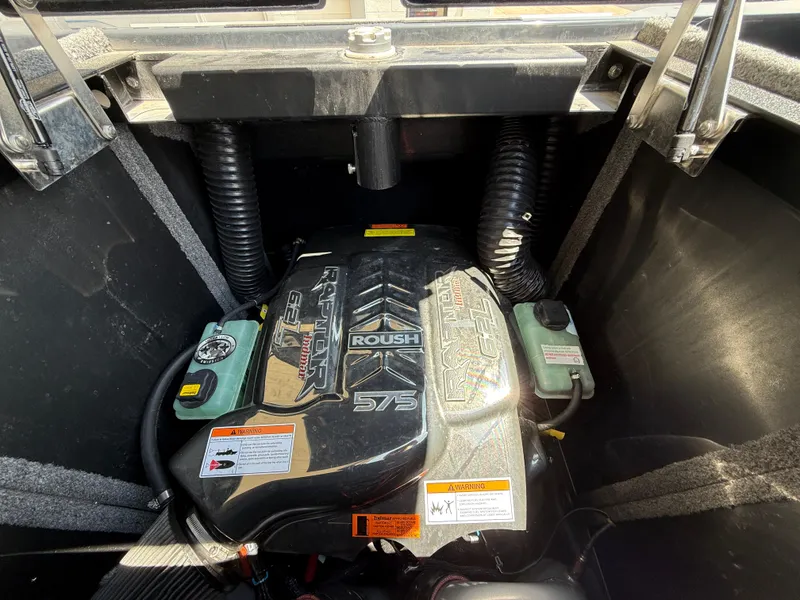 Slide: The Image of Engine compartment of a 2020 Supra SE550 boat featuring a Roush 575 engine. - 16