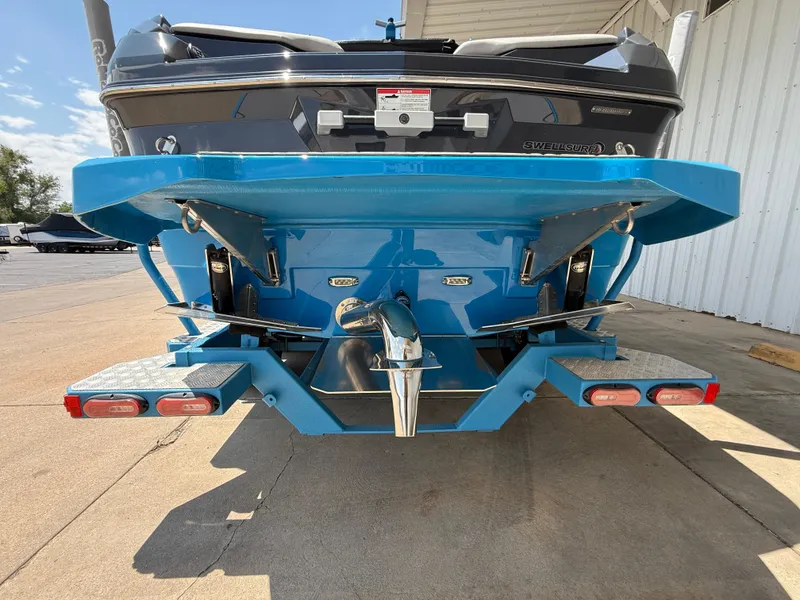 Slide: The Image of 2020 Supra SE550 boat rear view, showcasing blue hull and propeller system. - 6