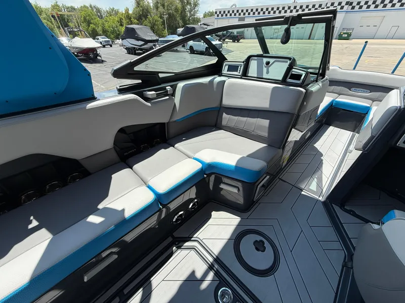 Slide: The Image of 2020 Supra SE550 boat interior with modern seating and sleek dashboard design. - 9