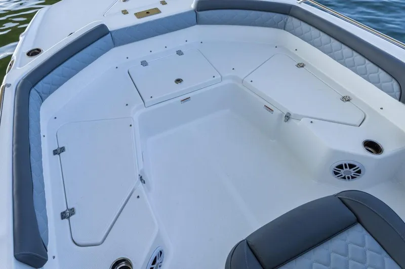 Slide: The Image of 2020 NauticStar 211 Hybrid boat with Yamaha engine docked in sunny marina. - 7